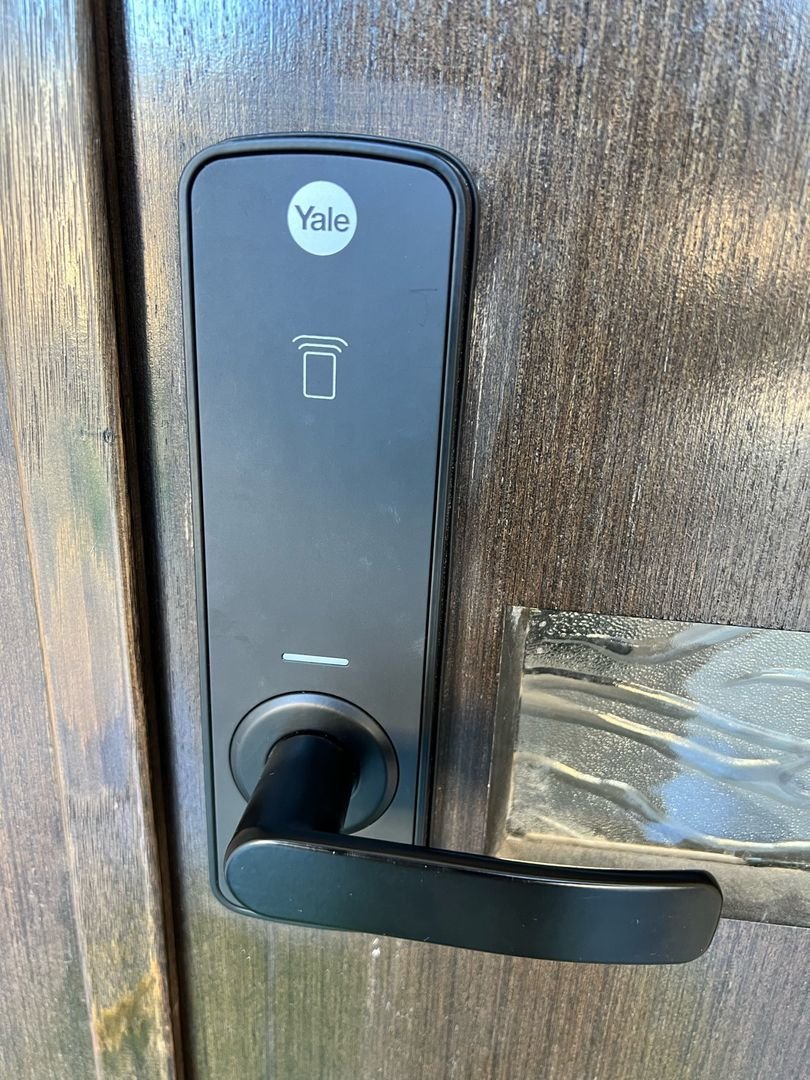 Close-up of Yale Unity Smart Entrance Lock on a wooden door